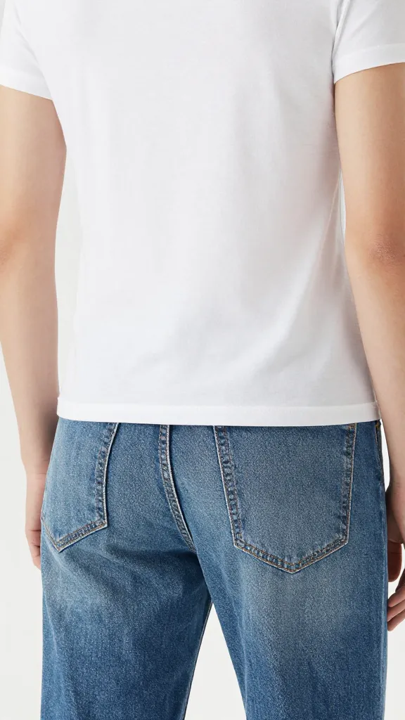 closeup of boxy white tee french-tucked into straight-leg jeans